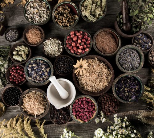 Homeopathy, herbal medicine on wooden table